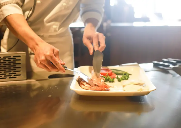 A chef plating a dish